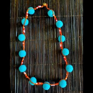 Electric fun micro blue pom Pom necklace from jade tribe.